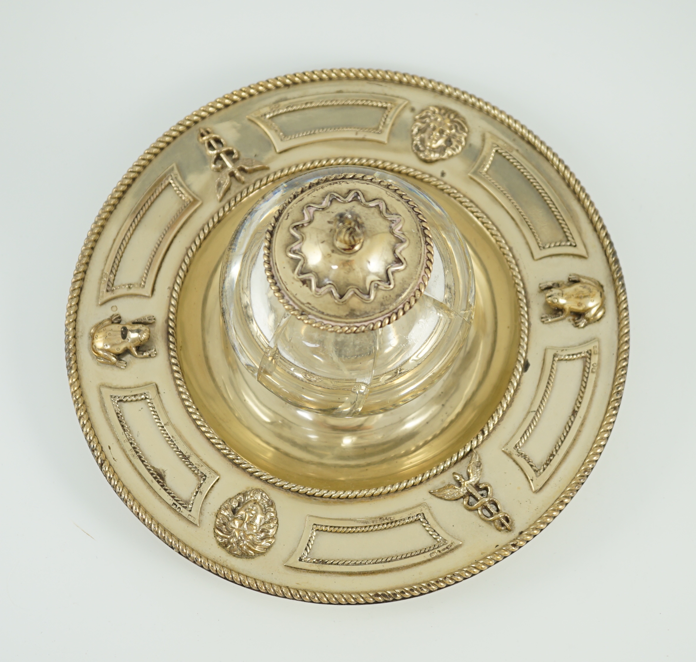 A Victorian silver gilt circular inkstand, by Robert Hennell III